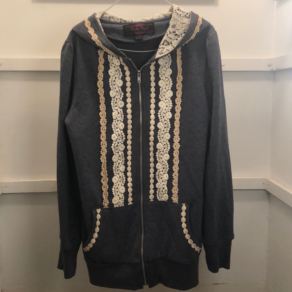 Almost new heather blue hoodie with white lace details on front, inside of hood